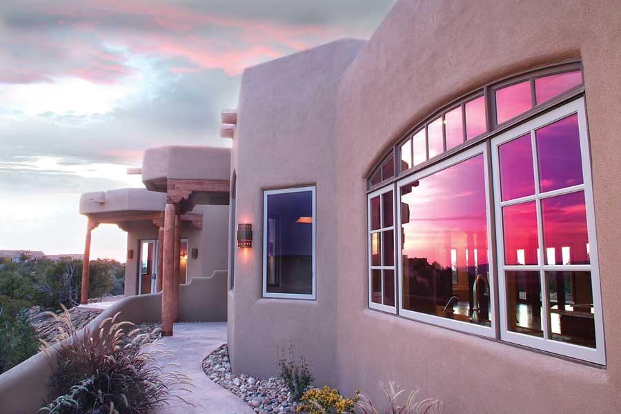 
Light-colored walls and conscientious overhangs reduce heat gain. 
